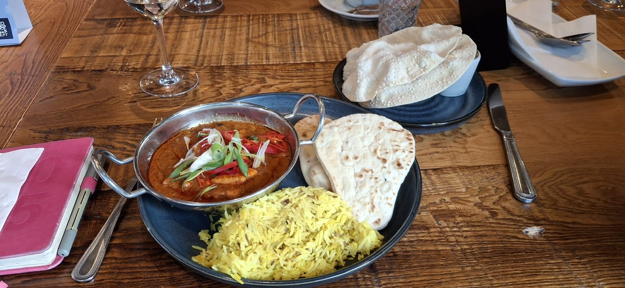 Indian meal dish on restaurant table.