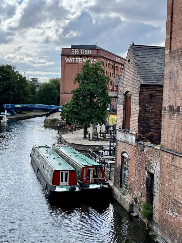 Two narrowboats moored side by side at Canal Wharf, Nottingham